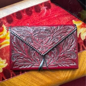 Cicele’ Mexican leather tooled, burgundy clutch and crossbody purse never used